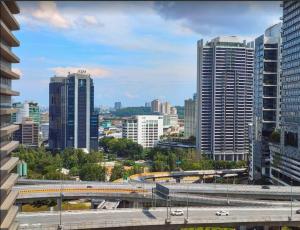 a view of a city with a train at Spacious City Duplex 2 to 6pax, 1U-Ikea-Curve, Netflix in Petaling Jaya