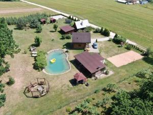 an aerial view of a farm with a pool and a house at Silamalas in Tukums
