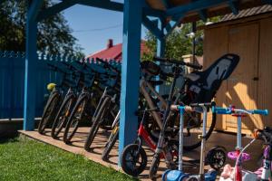 a row of bikes parked next to a building at Pensiunea Cuplu Călător in Jurilovca +68 photos