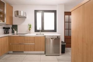 A kitchen or kitchenette at La Minilla Suite