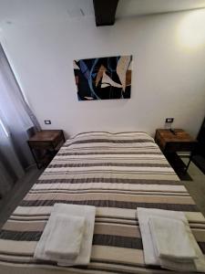 Postel nebo postele na pokoji v ubytování Alloggiamo