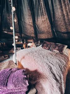 a bedroom with a bed in a tent at Glamping in - luxury tent 