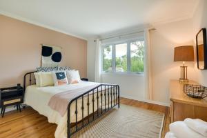 a bedroom with a bed and a window at Glen Ellyn Home Walk to Downtown Dining and Shops! in Glen Ellyn