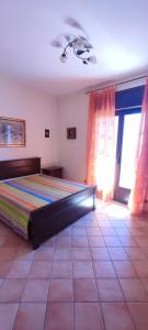 a bedroom with a bed in a room with at casa vacanze “Tra cielo e mare” Agerola in Agerola