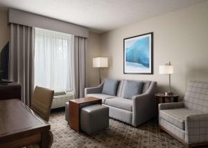a living room with a couch and a chair at Homewood Suites by Hilton Somerset in Somerset