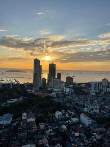 an aerial view of a city at sunset at Green Residences Staycation by PBYY with Complimentary breakfast for 2 in Manila