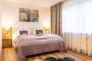 Rúm í herbergi á Appartements by Hofer