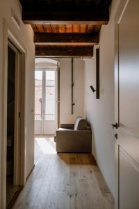 a living room with a couch and a window at Palazzo Garibaldi - Boutique Suites in Barletta