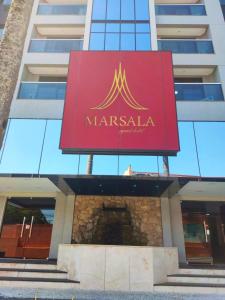 a sign for a marmalade hotel in front of a building at Apart Hotel 48 in Mogi das Cruzes