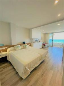 a bedroom with a large bed in a room at Holidays in My Barra Canteras in Las Palmas de Gran Canaria