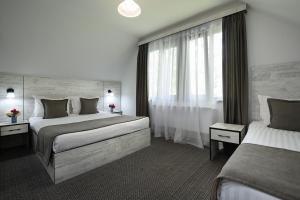 Voodi või voodid majutusasutuse Alpina Resort by Stellar Hotels, Tsaghkadzor toas