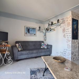 a living room with a couch and a table at Seaview holiday home in Kalkan