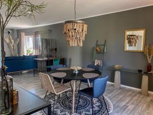 a dining room with a table and chairs at Olivia in Tholey +9 photos