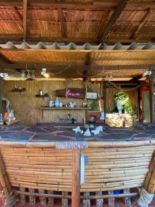 an outdoor kitchen with a large wooden counter top at Sea View Palm Villa - Tree House in Haad Yao
