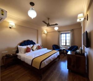 Ένα ή περισσότερα κρεβάτια σε δωμάτιο στο Hotel Chandra Raj Mahal