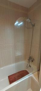 a shower with a glass door on a bath tub at Morello 1A in Calpe