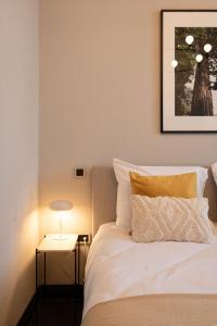 Postel nebo postele na pokoji v ubytování Boutique Hotel Kint