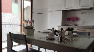a kitchen with a table with a tea set on it at IN CENTRO APARTMENT in Melfi
