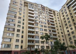 a large apartment building with many windows at Жетысу-3 дом 50 in Almaty