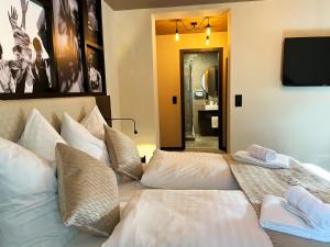 Postel nebo postele na pokoji v ubytování Hotel Da Toni