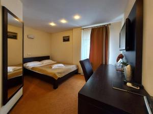 Postel nebo postele na pokoji v ubytování C&C Karo Resort