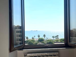 a view of the ocean from a window at Sealovers house Sea view Deluxe in Civitavecchia