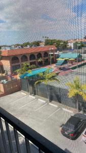 a view of a tennis court from a balcony at Fort Lauderdale Room Rental in Fort Lauderdale