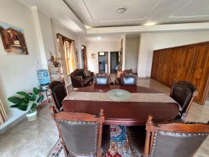 a dining room with a table and chairs at Manigelang Villa in Singaraja
