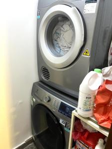 a washing machine sitting next to a washer at Spacious Apartment with 3-bedroom in District 7 in Ho Chi Minh City