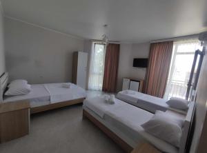 Postel nebo postele na pokoji v ubytování The best guest house-GAIOZ + 24 fotografií