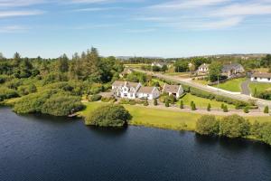 an aerial view of a house on an island in the water at Simply Donegal Adrihidbeg Cottage in Dungloe