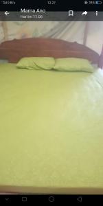 a close up of a bed in a room at Agus Family Homestay in Labuan Bajo