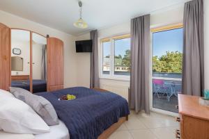 Posteľ alebo postele v izbe v ubytovaní Comfy Apartments with Balcony Turystyczna Międzyzdroje by Noclegi Renters