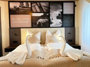 Postel nebo postele na pokoji v ubytování Hotel Da Toni