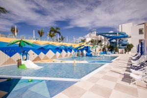 a water park with a water slide and slides at Servatur Puerto Azul in Puerto Rico de Gran Canaria