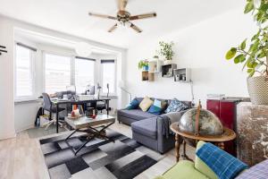 a living room with a couch and a table at Chambres en appartements partagés in Liège +34 photos