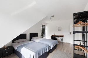 Postel nebo postele na pokoji v ubytování Ferienwohnung zur Nordhelle