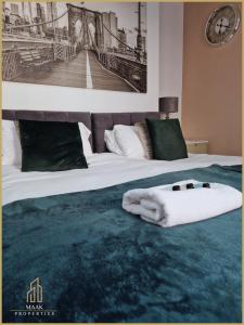 Łóżko lub łóżka w pokoju w obiekcie Minehead Suite