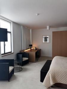 Uma cama ou camas num quarto em Hotel Messeyne
