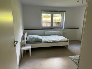 a bedroom with a bed and a window at L8 Street - Leimen - Basement floor in Leimen