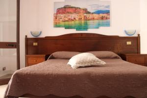 Voodi või voodid majutusasutuse Hotel Grotticelli toas