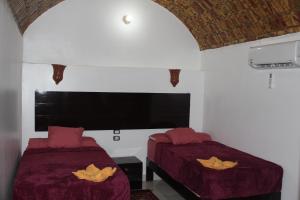 Voodi või voodid majutusasutuse Ajwa Guest House toas