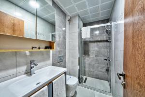 a bathroom with a shower and a sink and a toilet at North Blue Life in Istanbul