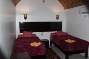 Voodi või voodid majutusasutuse Ajwa Guest House toas
