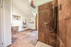 a bathroom with a shower with a glass door at Naturliebe Samerberg in Samerberg