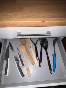 a drawer filled with lots of cooking utensils at Forge Cottage in Mountain Ash