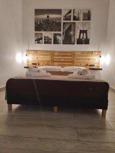 a large bed in a room with at LA CASA DEL RIONE SANITA’ in Naples