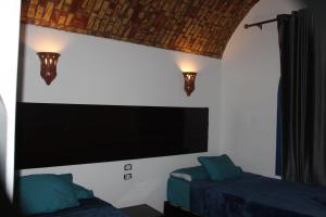 Voodi või voodid majutusasutuse Ajwa Guest House toas