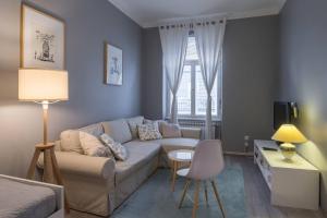 Posedenie v ubytovaní Cozy City Center Apartment