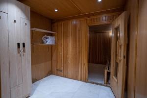 a small room with a door and a walk in shower at Rosemond Al Hamra in Jeddah